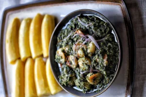 Ndole & Ripe Plantain served in a trail